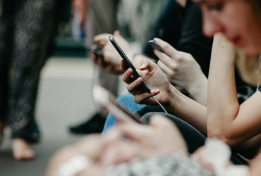 people looking at cell phones